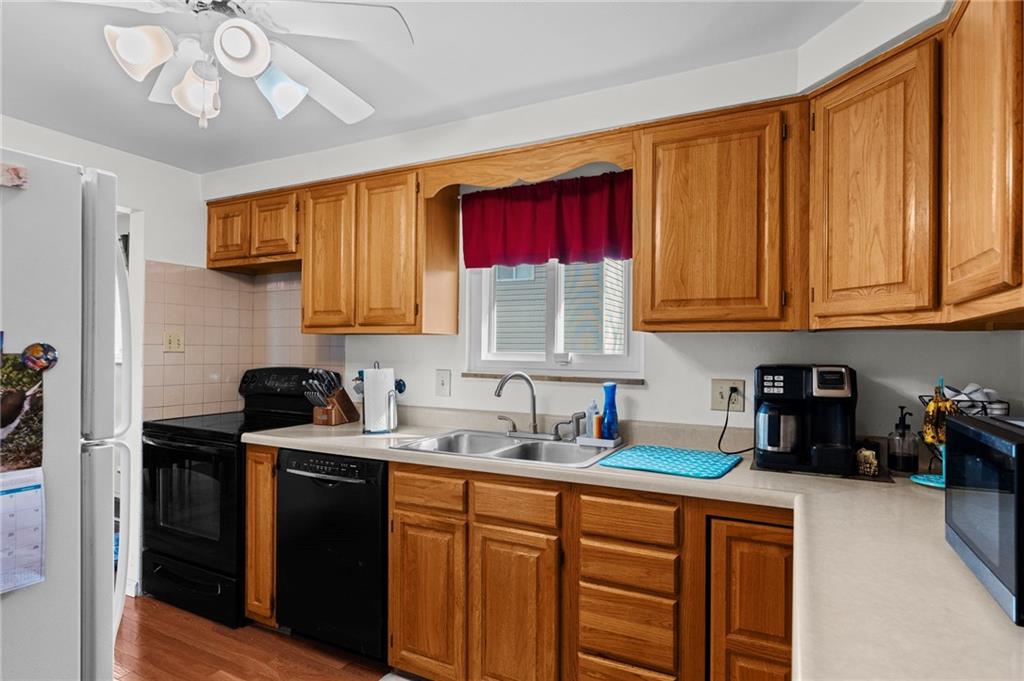 800 Burchfield Road Allison Park, PA 15101 - Photo 10 of 30 a kitchen with stainless steel appliances granite countertop a sink a stove cabinets and a refrigerator