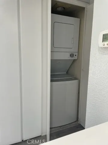 a utility room with washing machine