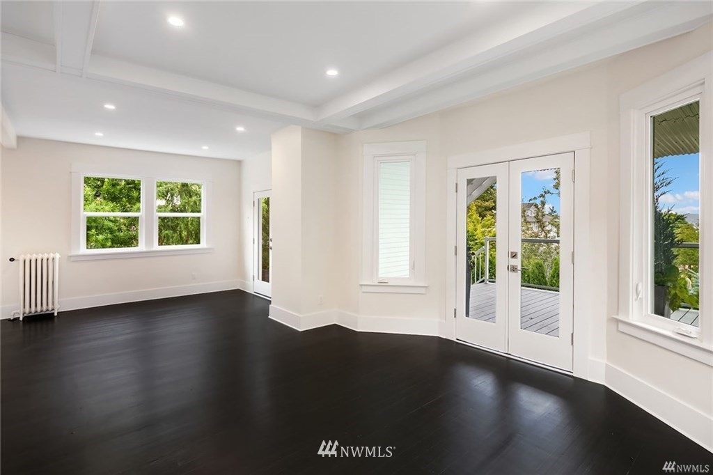 206 30th Avenue Seattle, WA 98122 - Photo 15 of 21 a view of a livingroom with wooden floor and a window