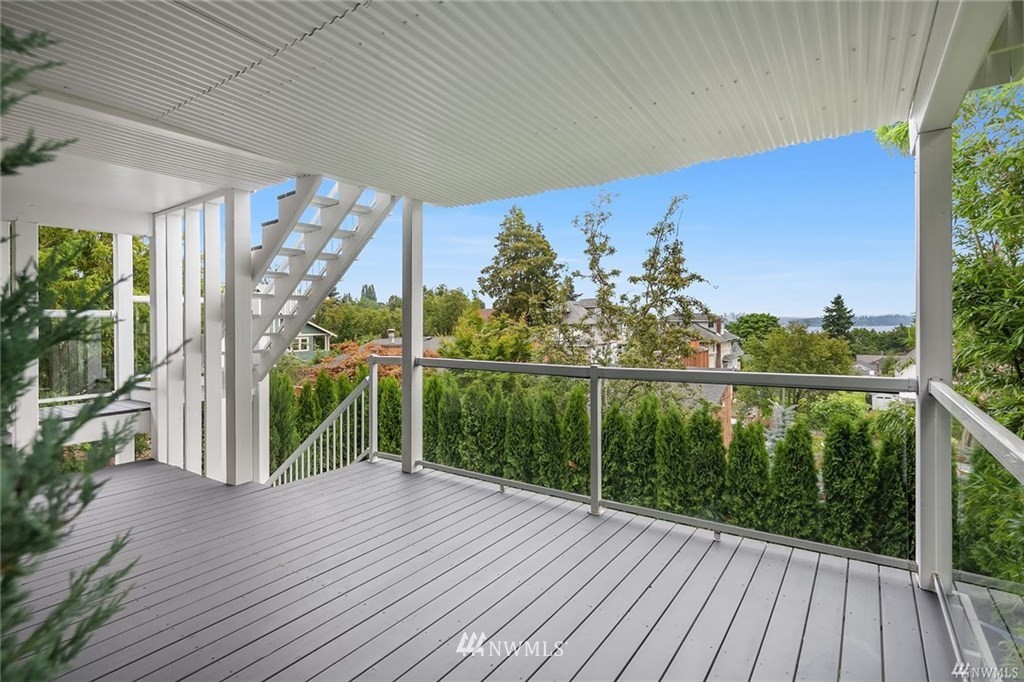 206 30th Avenue Seattle, WA 98122 - Photo 16 of 21 a view of a balcony with lake view and a floor to ceiling window