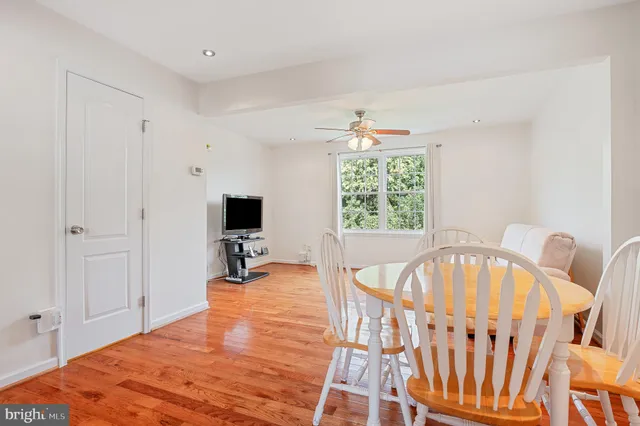 a kitchen with stainless steel appliances granite countertop a refrigerator a stove and a sink