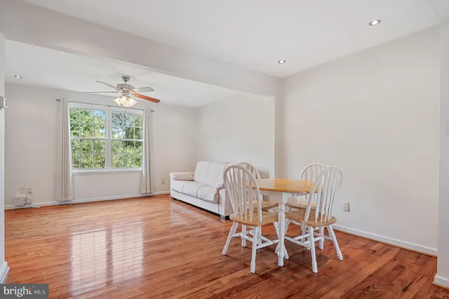 a kitchen with refrigerator cabinets and wooden floor