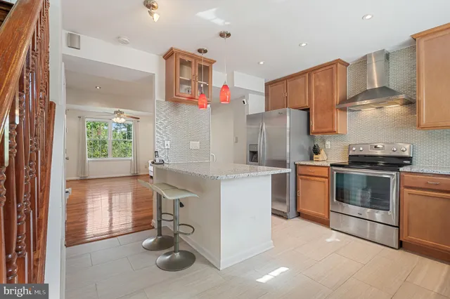 a kitchen with a refrigerator and a sink