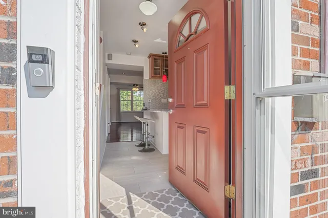 a view of a backyard with table and chairs and wooden fence