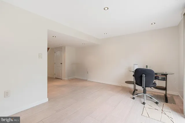 a bathroom with a sink a toilet a mirror and shower