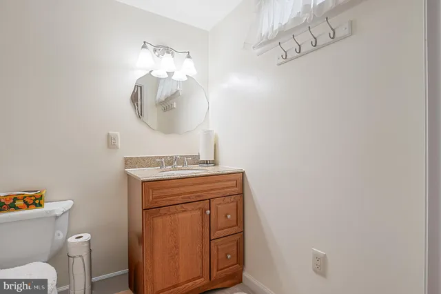 a white toilet sitting next to a bath tub