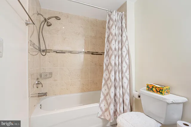 a view of a hallway with entryway wooden floor and front door