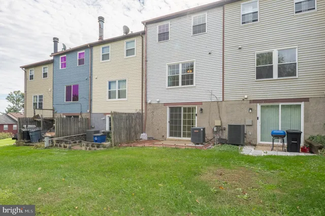 a front view of house with yard and outdoor seating