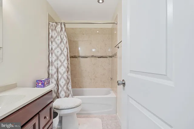 a bedroom with a bed and dresser