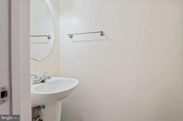 a bathroom with a sink and mirror