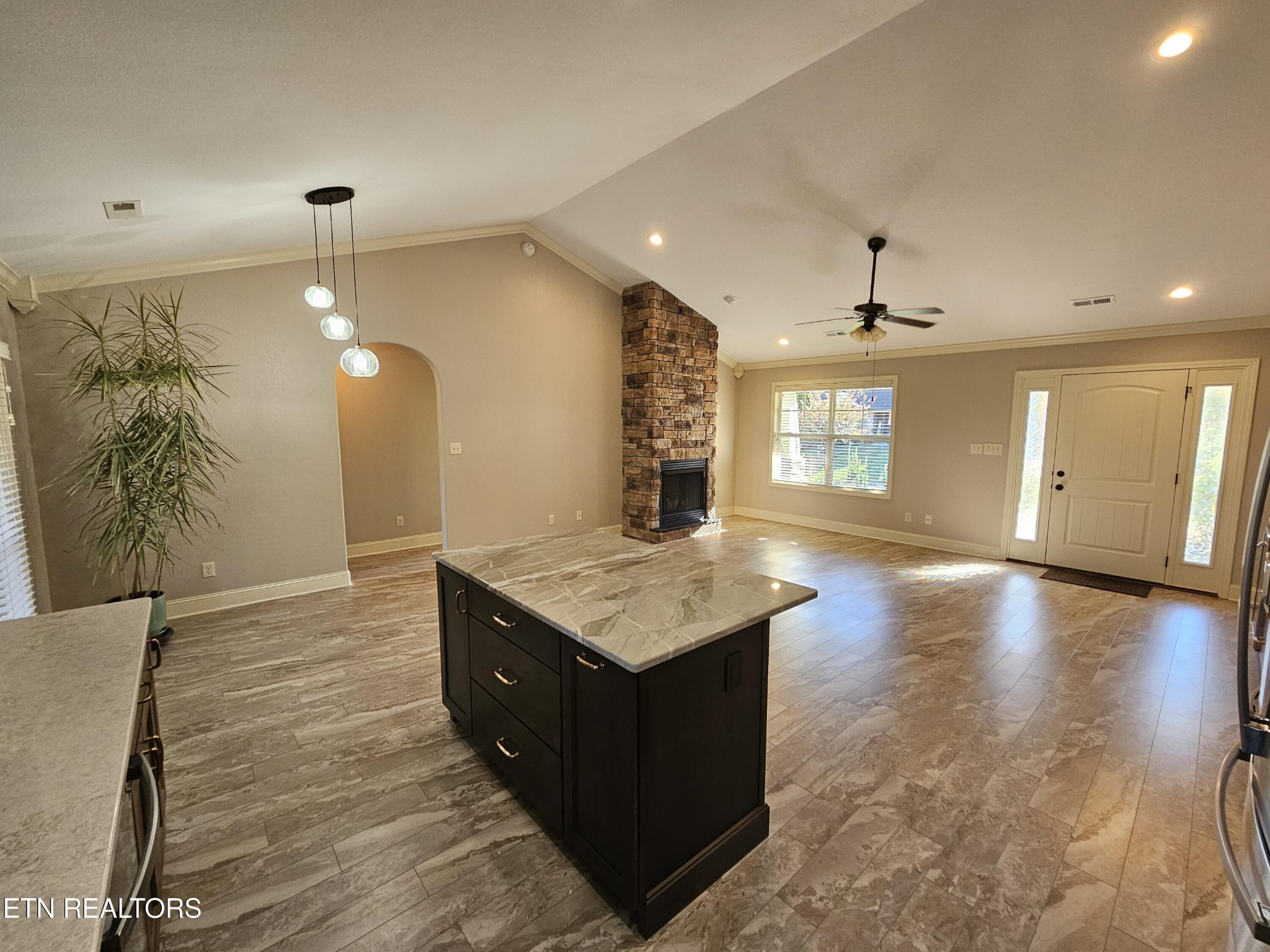 5920 Whisper Ridge Lane Corryton, TN 37721 - Photo 12 of 49 a kitchen with a stove and a wooden floor