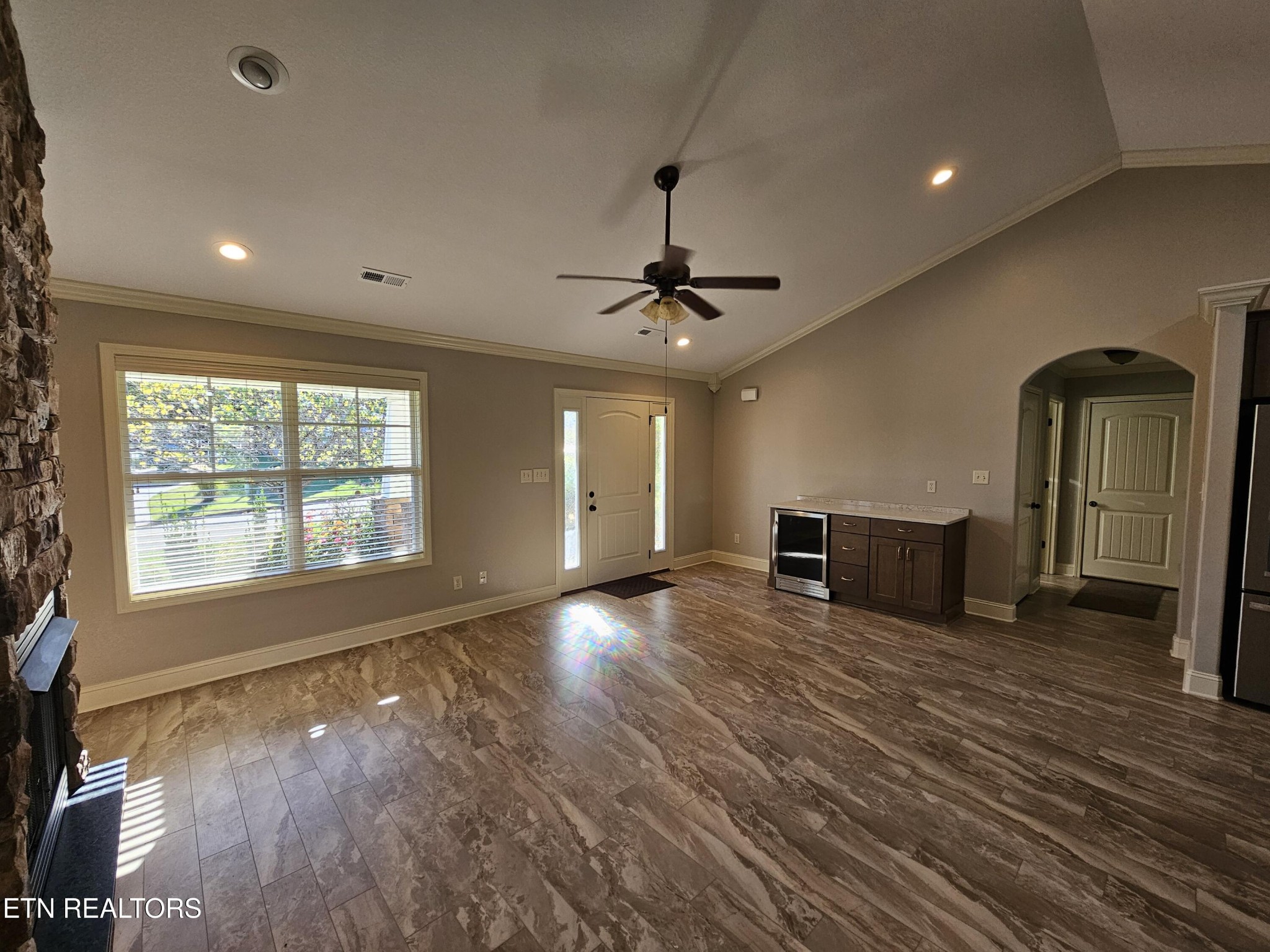 5920 Whisper Ridge Lane Corryton, TN 37721 - Photo 13 of 49 a view of an empty room with window and wooden floor