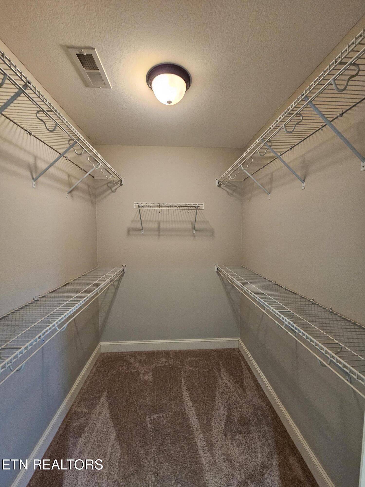 5920 Whisper Ridge Lane Corryton, TN 37721 - Photo 17 of 49 a view of a room with racks on the wall