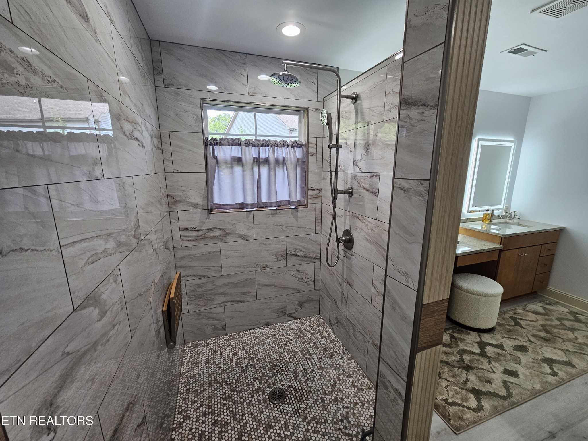 5920 Whisper Ridge Lane Corryton, TN 37721 - Photo 20 of 49 a bathroom with a sink and a shower