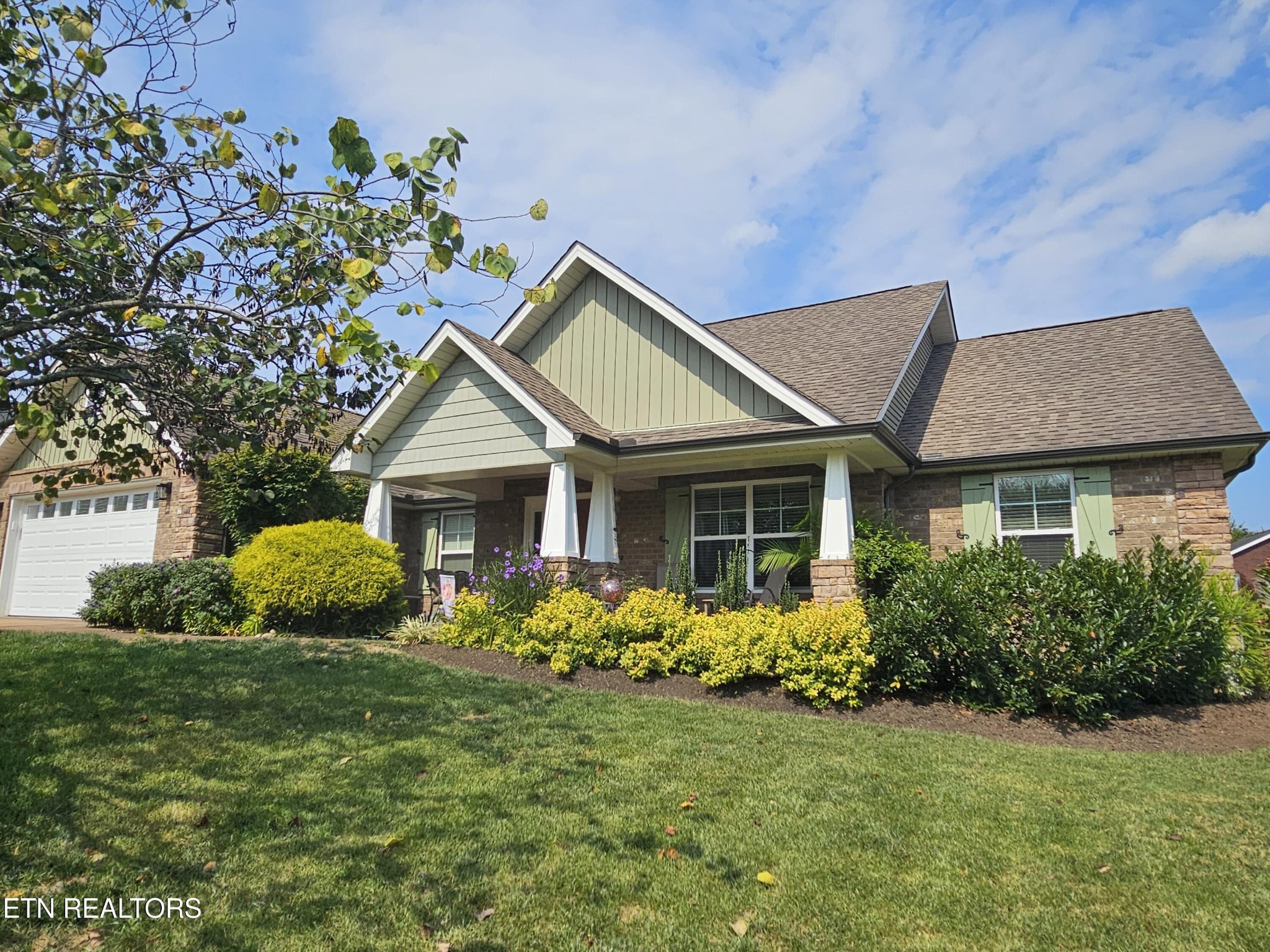 5920 Whisper Ridge Lane Corryton, TN 37721 - Photo 32 of 49 a front view of a house with garden