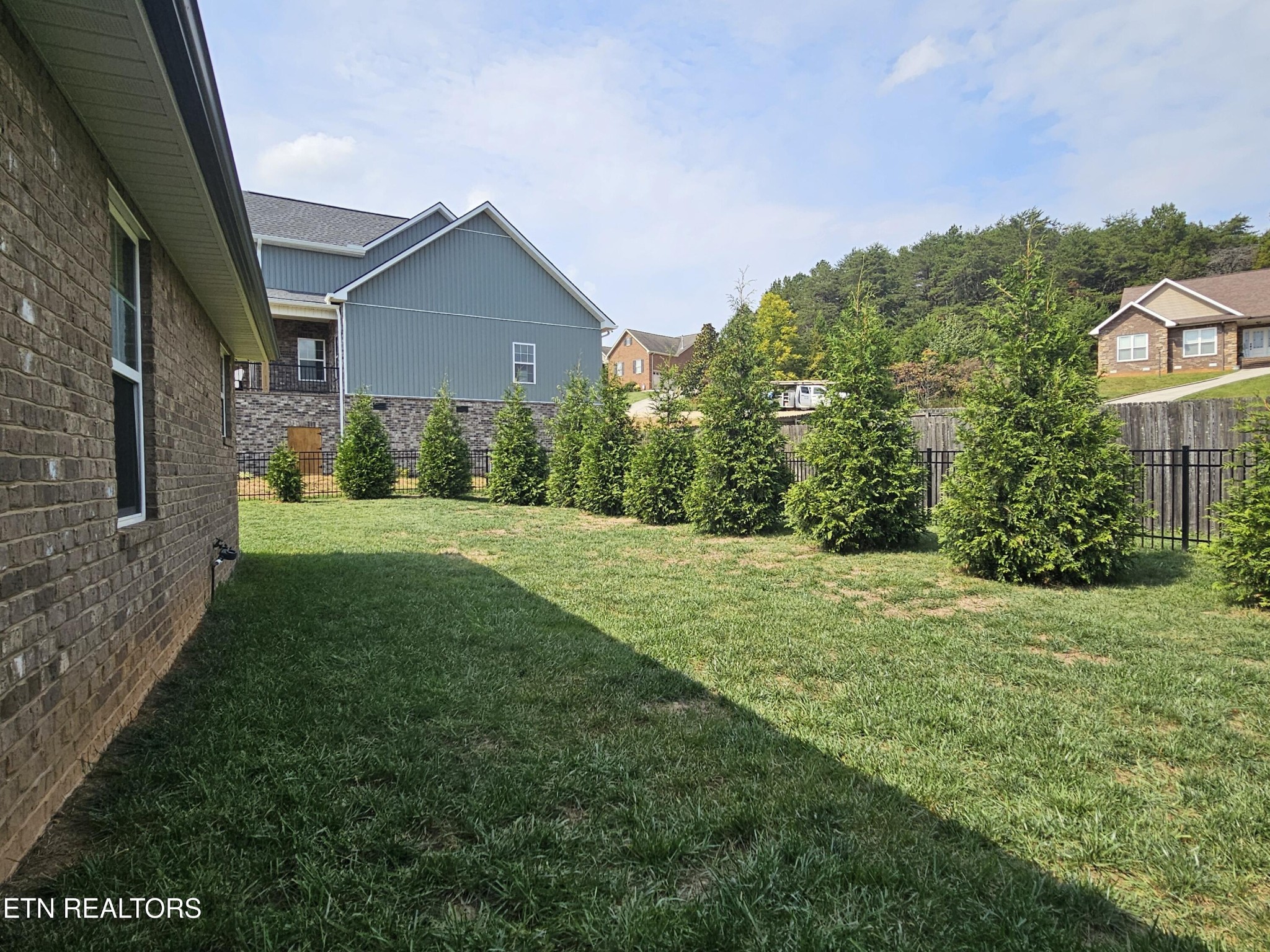 5920 Whisper Ridge Lane Corryton, TN 37721 - Photo 36 of 49 a view of a house and garden