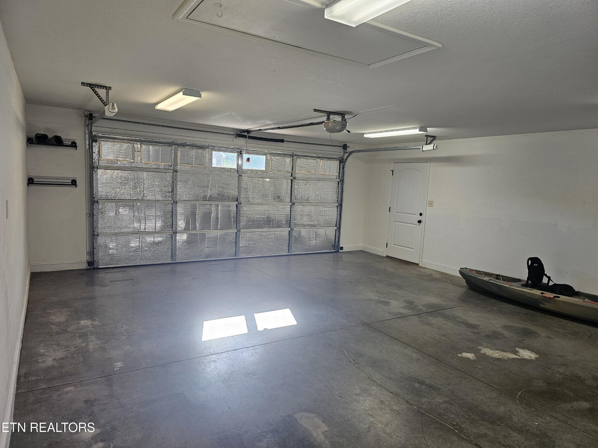 5920 Whisper Ridge Lane Corryton, TN 37721 - Photo 39 of 49 an empty room with windows and air conditioner
