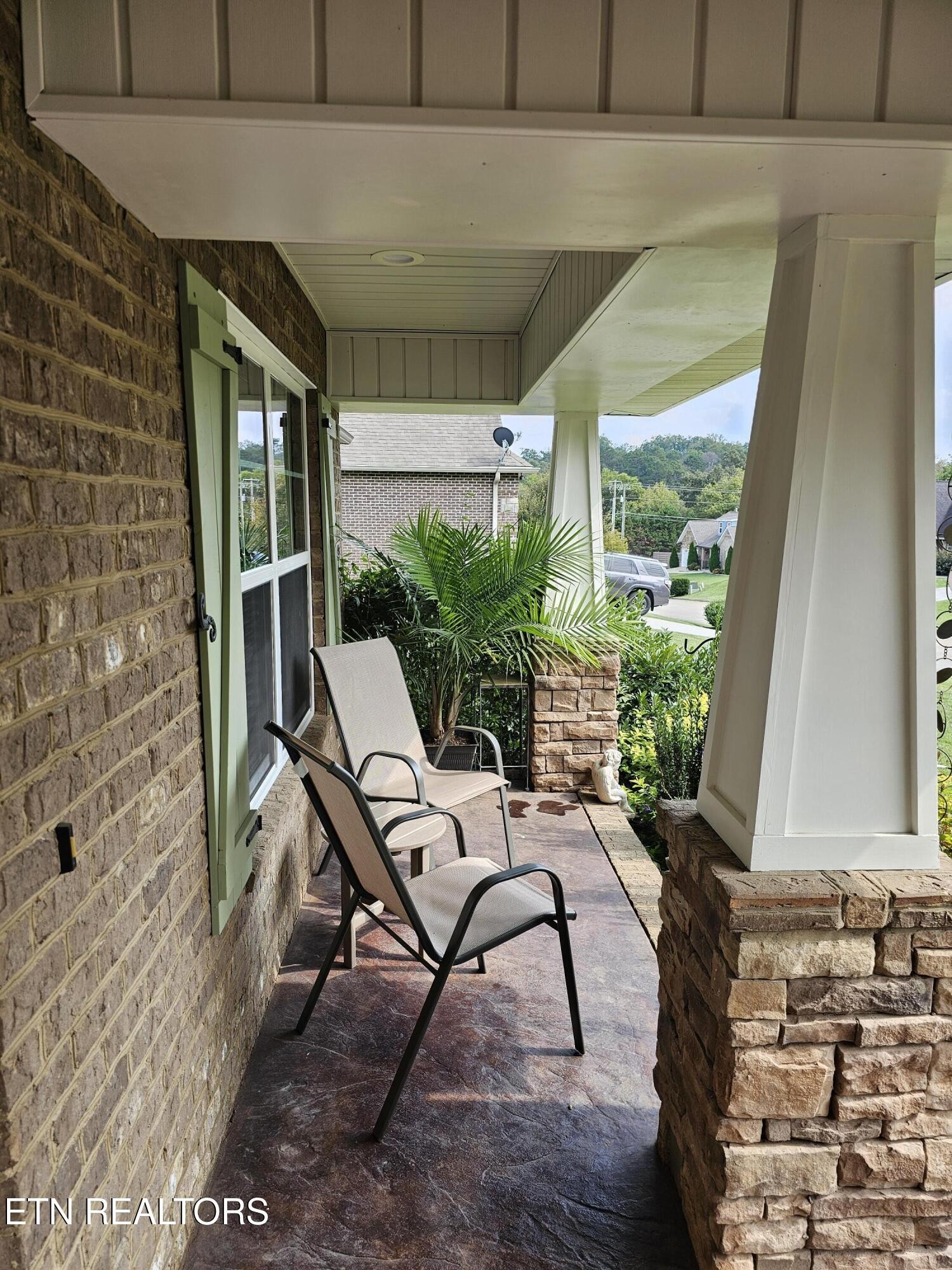 5920 Whisper Ridge Lane Corryton, TN 37721 - Photo 41 of 49 a building outdoor space with patio furniture and potted plants