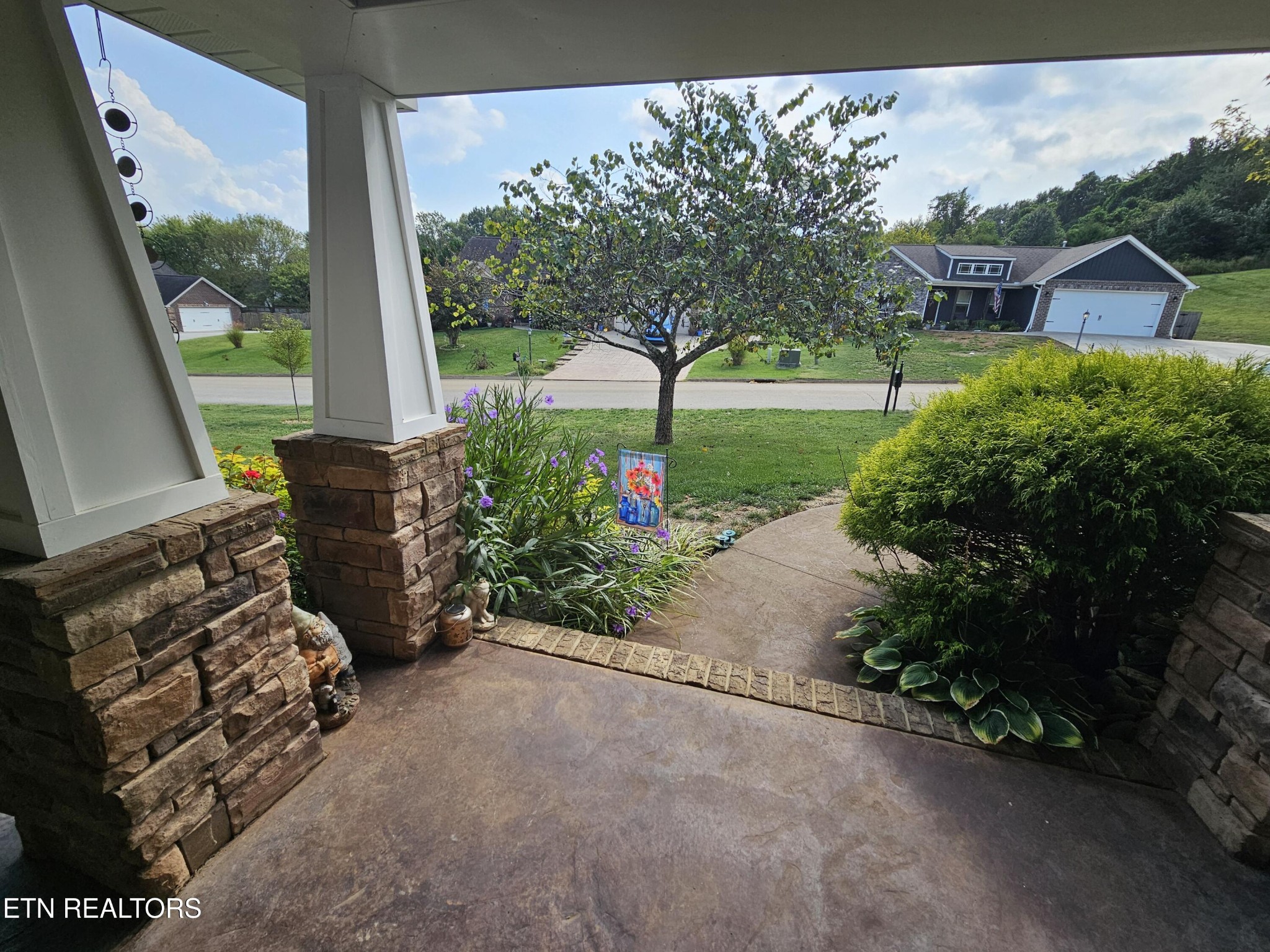 5920 Whisper Ridge Lane Corryton, TN 37721 - Photo 43 of 49 a view of a garden with patio