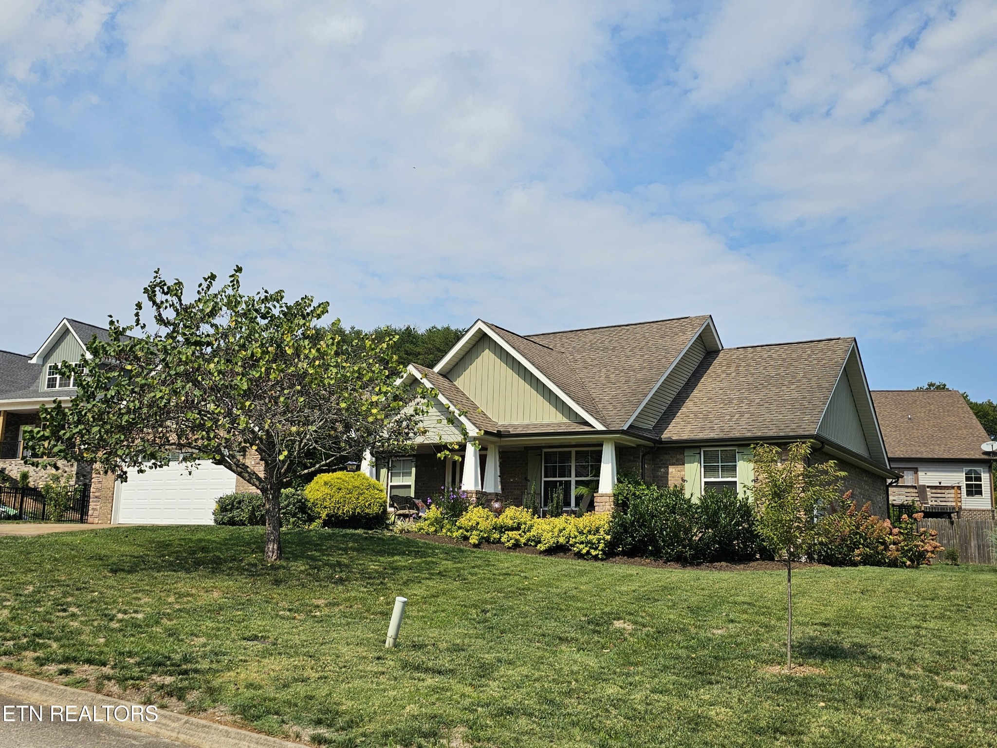 5920 Whisper Ridge Lane Corryton, TN 37721 - Photo 44 of 49 a front view of a house with garden