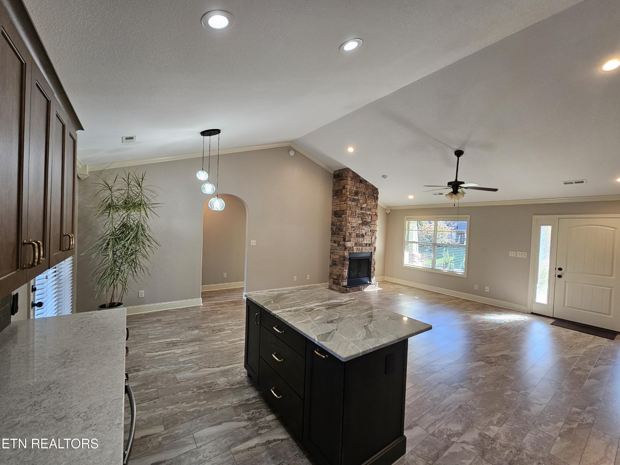 5920 Whisper Ridge Lane Corryton, TN 37721 - Photo 10 of 49 an open kitchen with a sink and a refrigerator