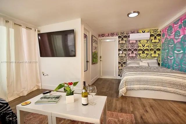 a bedroom with a bed and a dresser