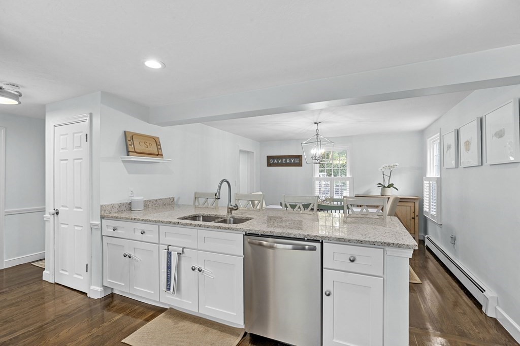 37 Old Forge Road Scituate, MA 02066 - Photo 12 of 42 a kitchen with a granite countertop white cabinets and white appliances