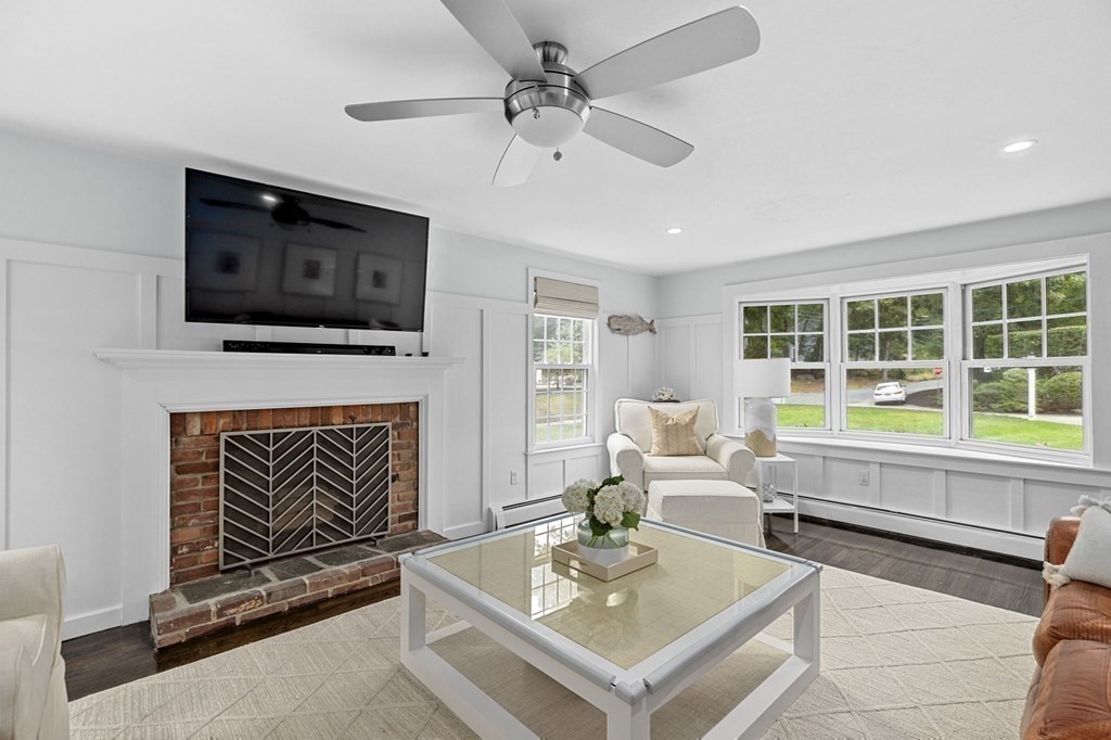 37 Old Forge Road Scituate, MA 02066 - Photo 23 of 42 a living room with furniture a fireplace and a flat screen tv