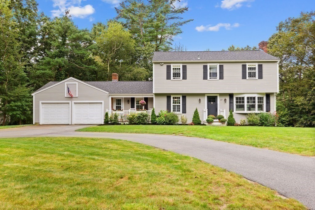 37 Old Forge Road Scituate, MA 02066 - Photo 42 of 42 a front view of a house with a yard and garage