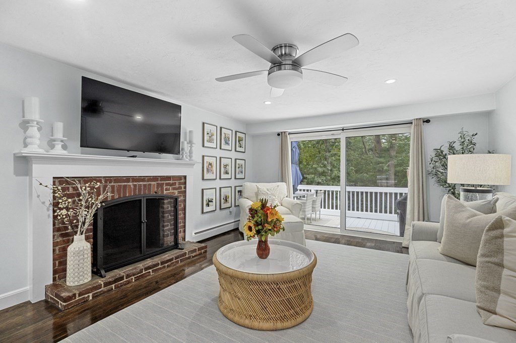 37 Old Forge Road Scituate, MA 02066 - Photo 6 of 42 a living room with furniture a flat screen tv and a fireplace