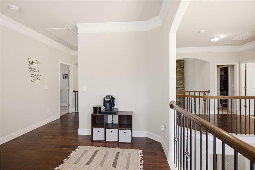120 Jones Creek Circle Anderson, SC 29621 - Photo 15 of 43 This spacious hallway features rich hardwood flooring and elegant crown molding throughout.