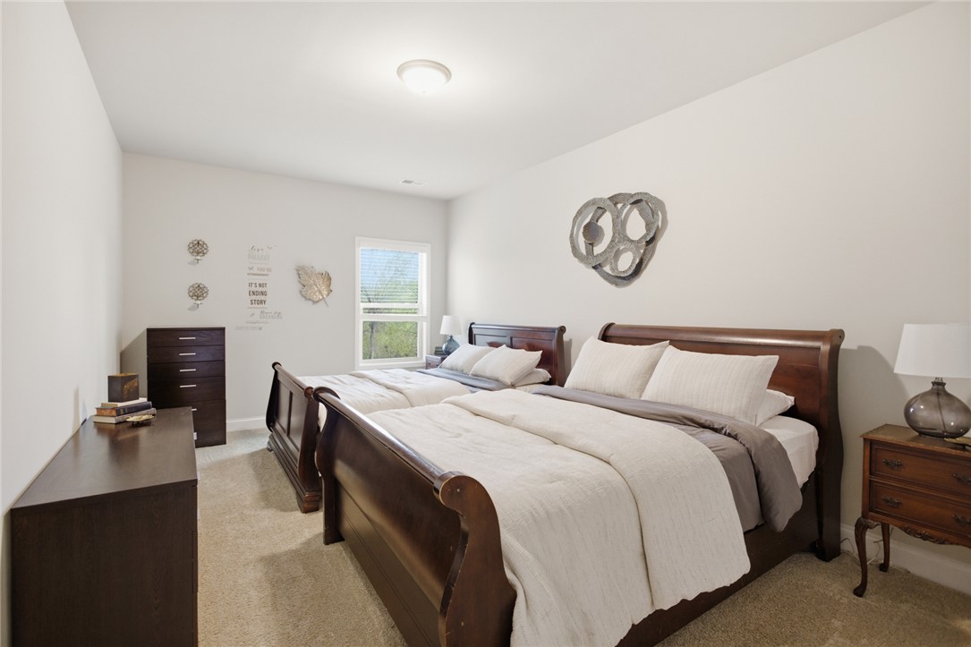 120 Jones Creek Circle Anderson, SC 29621 - Photo 24 of 43 This bright and airy bedroom features soft carpeting, a window, and ample space.