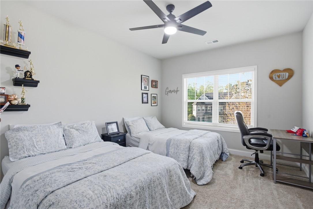 120 Jones Creek Circle Anderson, SC 29621 - Photo 27 of 43 This cozy bedroom offers a tranquil retreat with soft lighting and ample natural light.