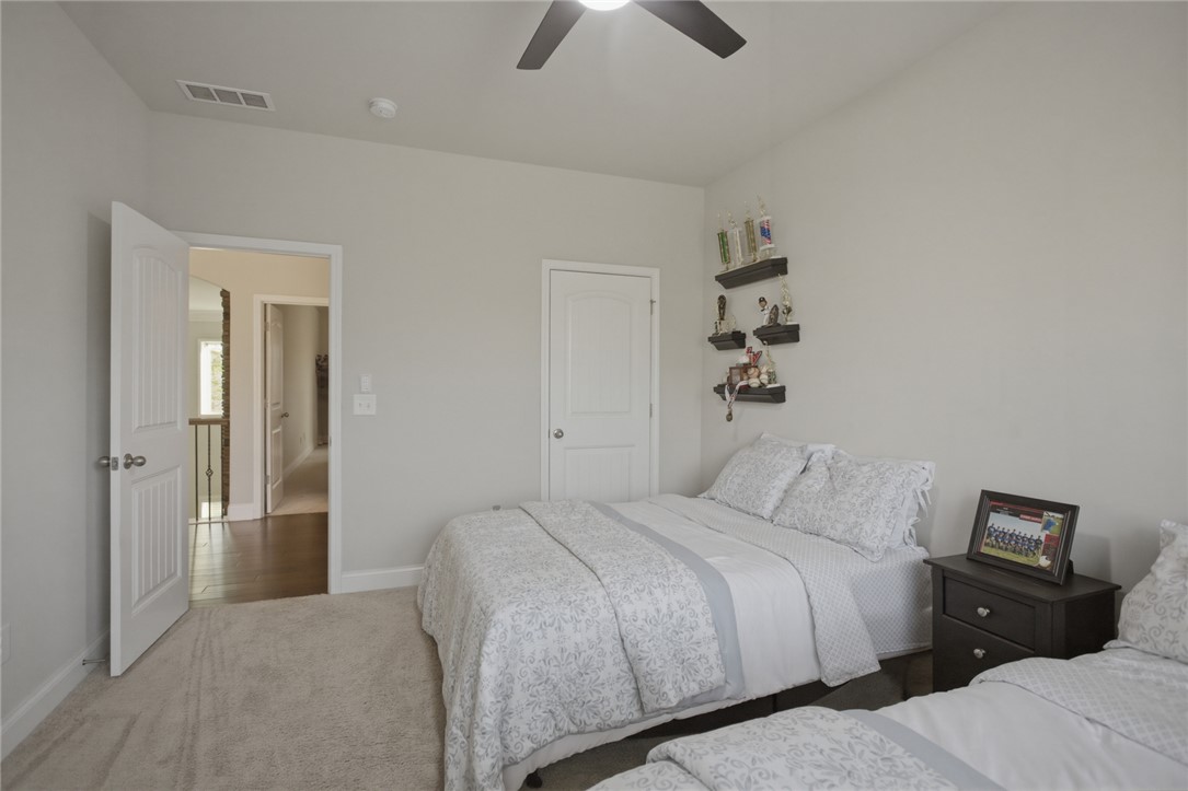 120 Jones Creek Circle Anderson, SC 29621 - Photo 28 of 43 This spacious bedroom offers comfortable carpeting and a ceiling fan, creating a welcoming retreat.