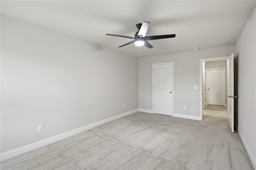 120 Jones Creek Circle Anderson, SC 29621 - Photo 30 of 43 This spacious room features neutral tones and soft carpeting, creating a tranquil and inviting atmosphere.