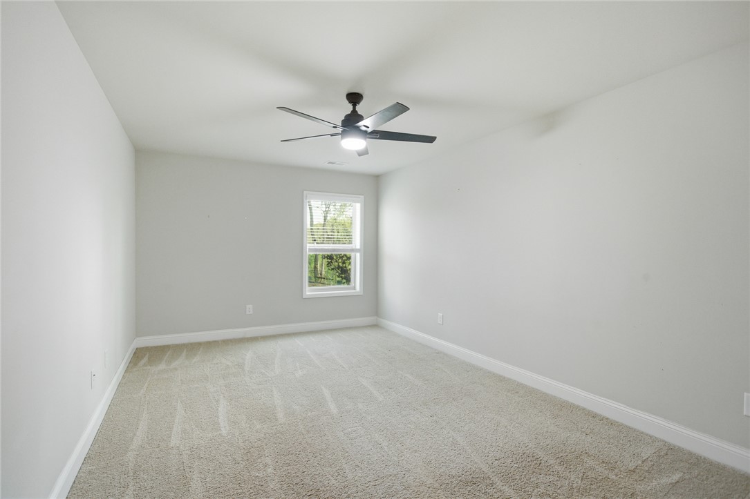 120 Jones Creek Circle Anderson, SC 29621 - Photo 31 of 43 This airy bedroom offers a tranquil retreat with soft carpet and abundant natural light.