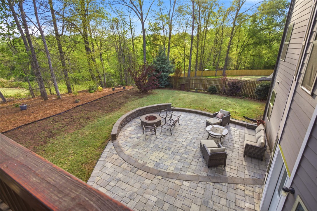 120 Jones Creek Circle Anderson, SC 29621 - Photo 40 of 43 This tranquil outdoor space features a paver patio with a built-in fire pit, perfect for gatherings.