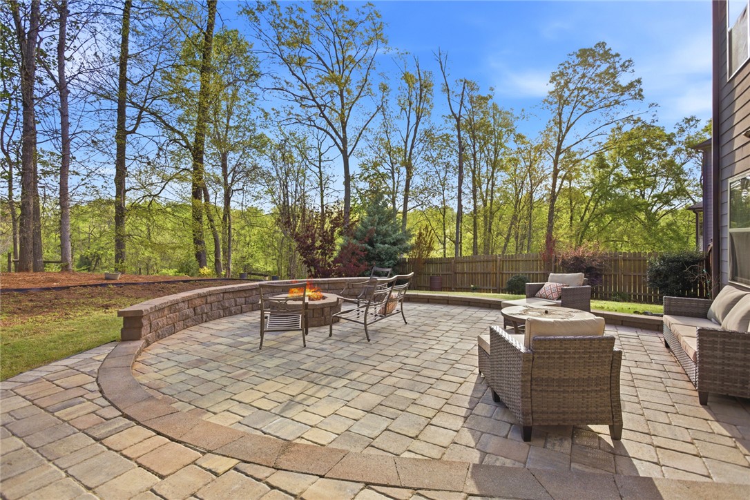 120 Jones Creek Circle Anderson, SC 29621 - Photo 41 of 43 This spacious paver patio provides an inviting outdoor retreat with a built-in fire pit.