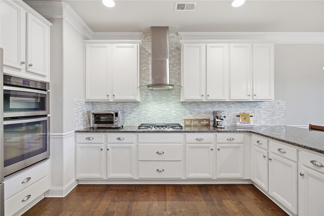 120 Jones Creek Circle Anderson, SC 29621 - Photo 7 of 43 This bright kitchen features modern appliances and elegant finishes, ideal for culinary creations.