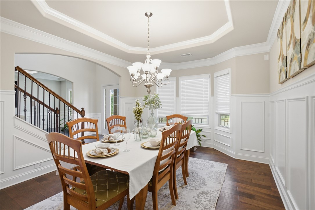 120 Jones Creek Circle Anderson, SC 29621 - Photo 10 of 43 Elegant dining space featuring rich wood flooring and classic wainscoting.