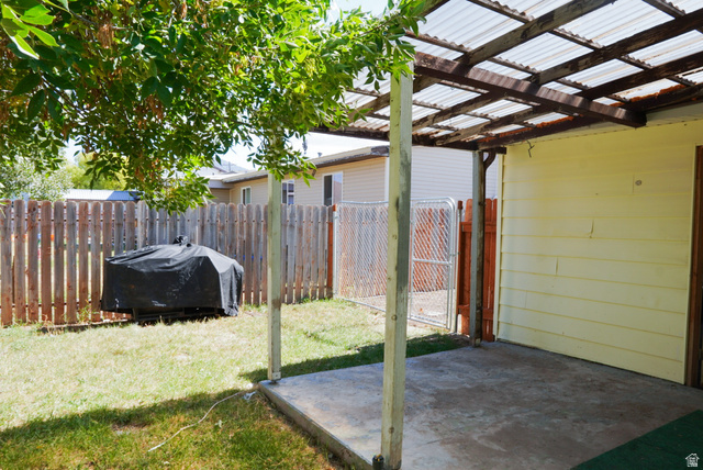 324 Stringtown Road Georgetown, ID 83239 - Photo 35 of 49 Fenced backyard featuring a patio and a pergola