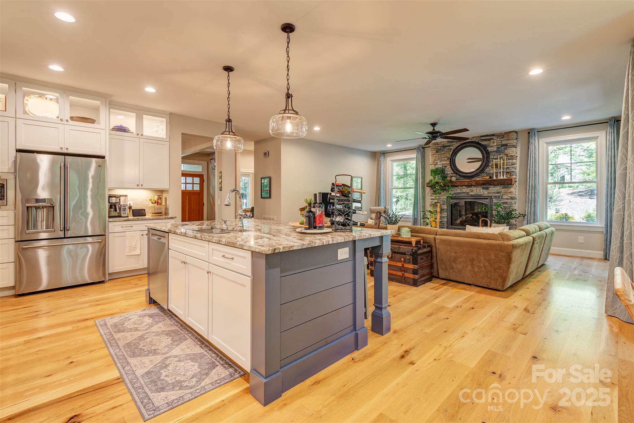 21 Ducketts Grove Road Fletcher, NC 28732 - Photo 13 of 42 a large kitchen with kitchen island a large counter space a sink a window and stainless steel appliances