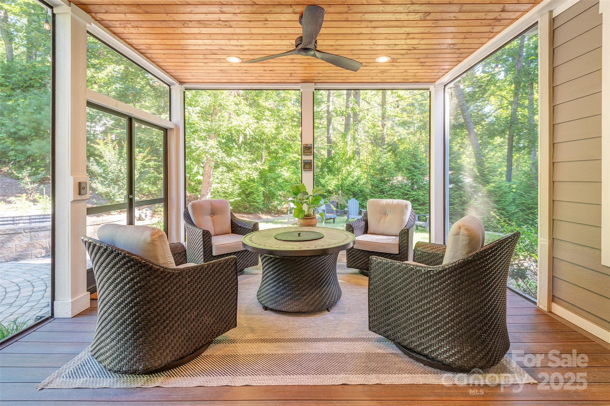 21 Ducketts Grove Road Fletcher, NC 28732 - Photo 18 of 42 a living room with couches and a dining table with garden view