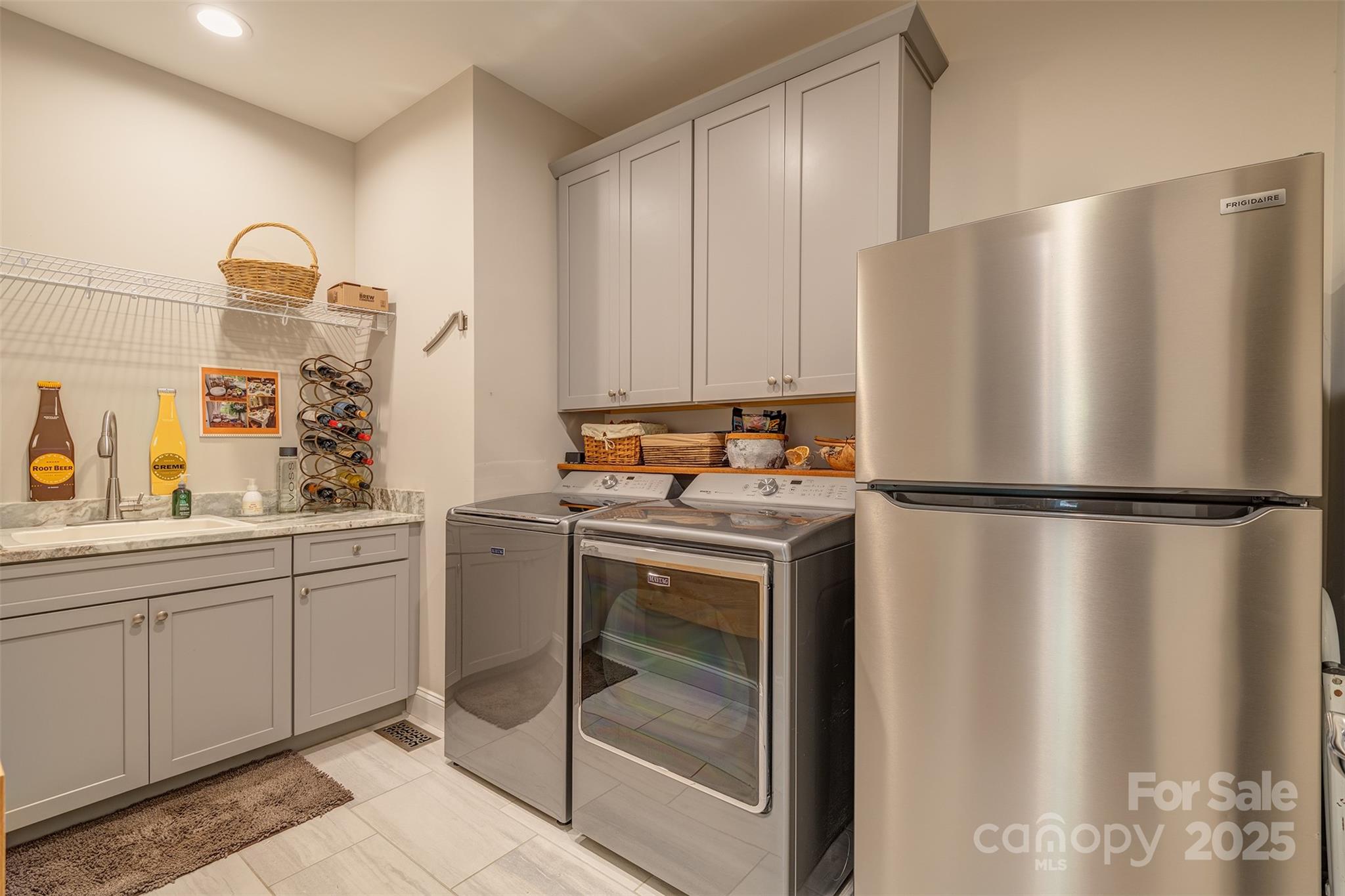 21 Ducketts Grove Road Fletcher, NC 28732 - Photo 19 of 42 a kitchen with a refrigerator and a sink