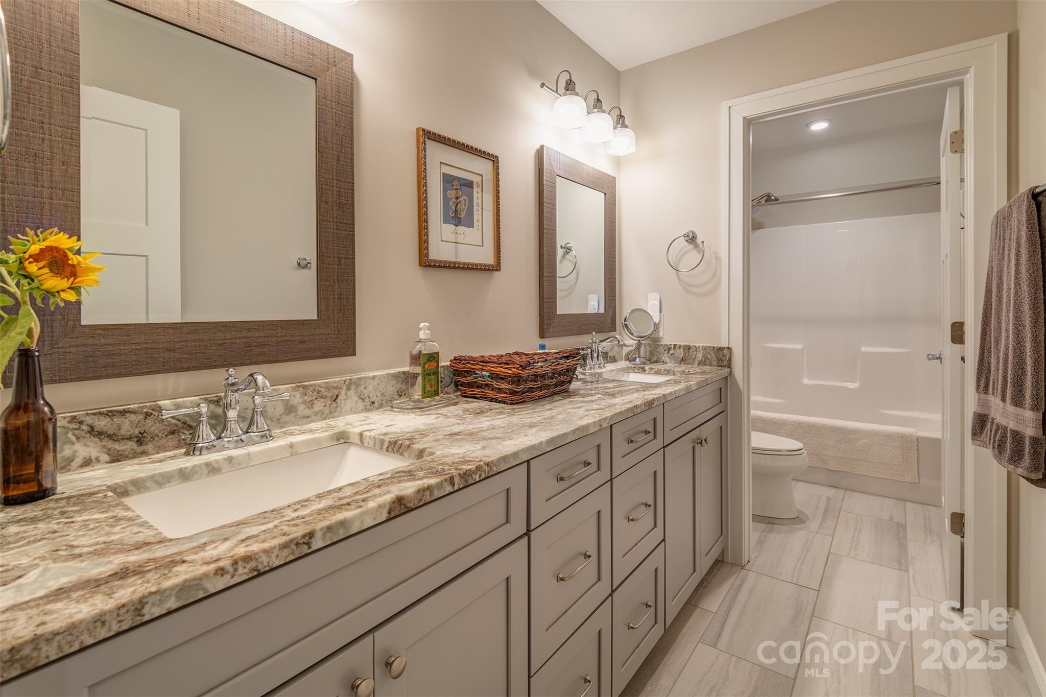 21 Ducketts Grove Road Fletcher, NC 28732 - Photo 29 of 42 a bathroom with a granite countertop sink mirror and double