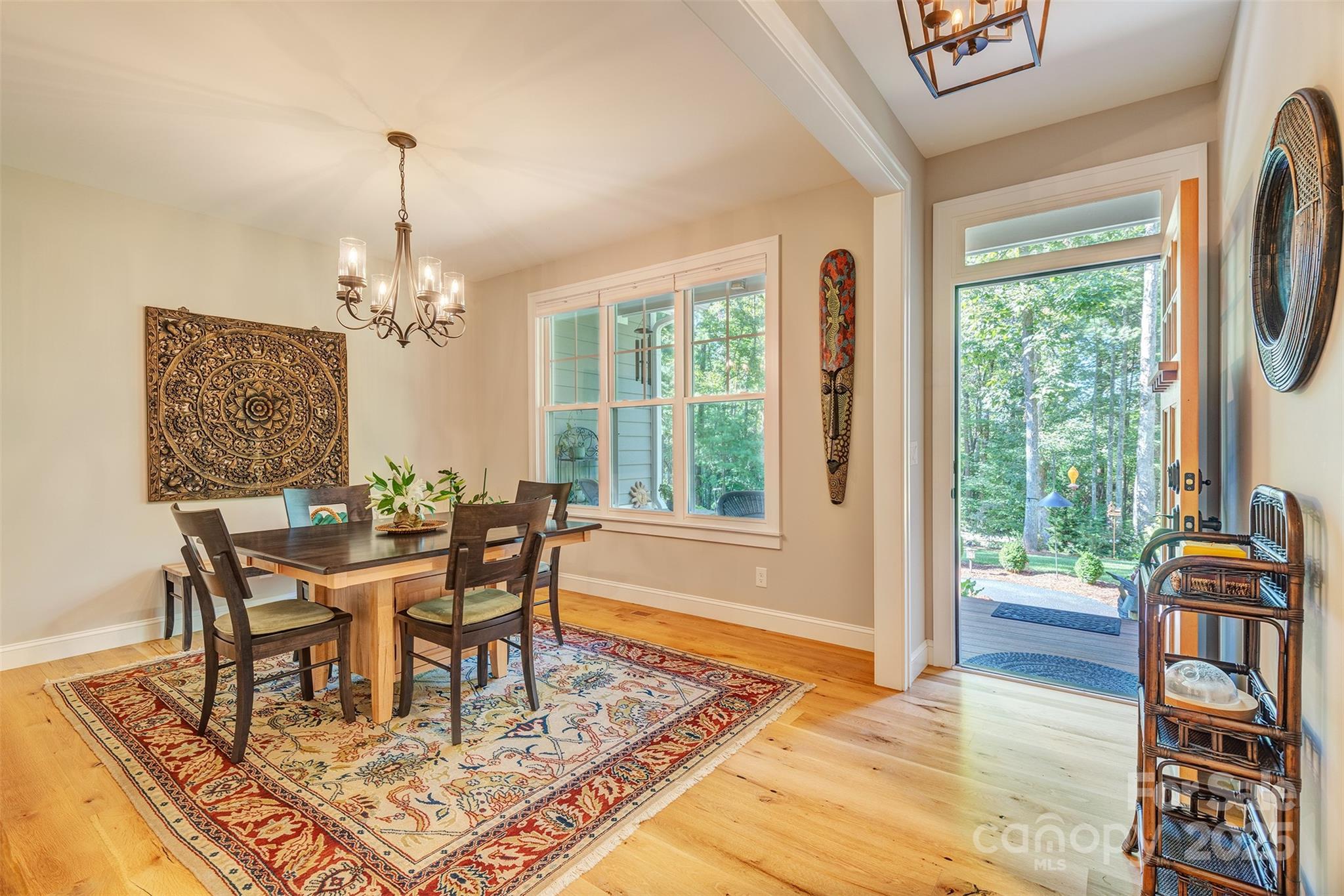 21 Ducketts Grove Road Fletcher, NC 28732 - Photo 3 of 42 a view of a dining room with furniture window and wooden floor
