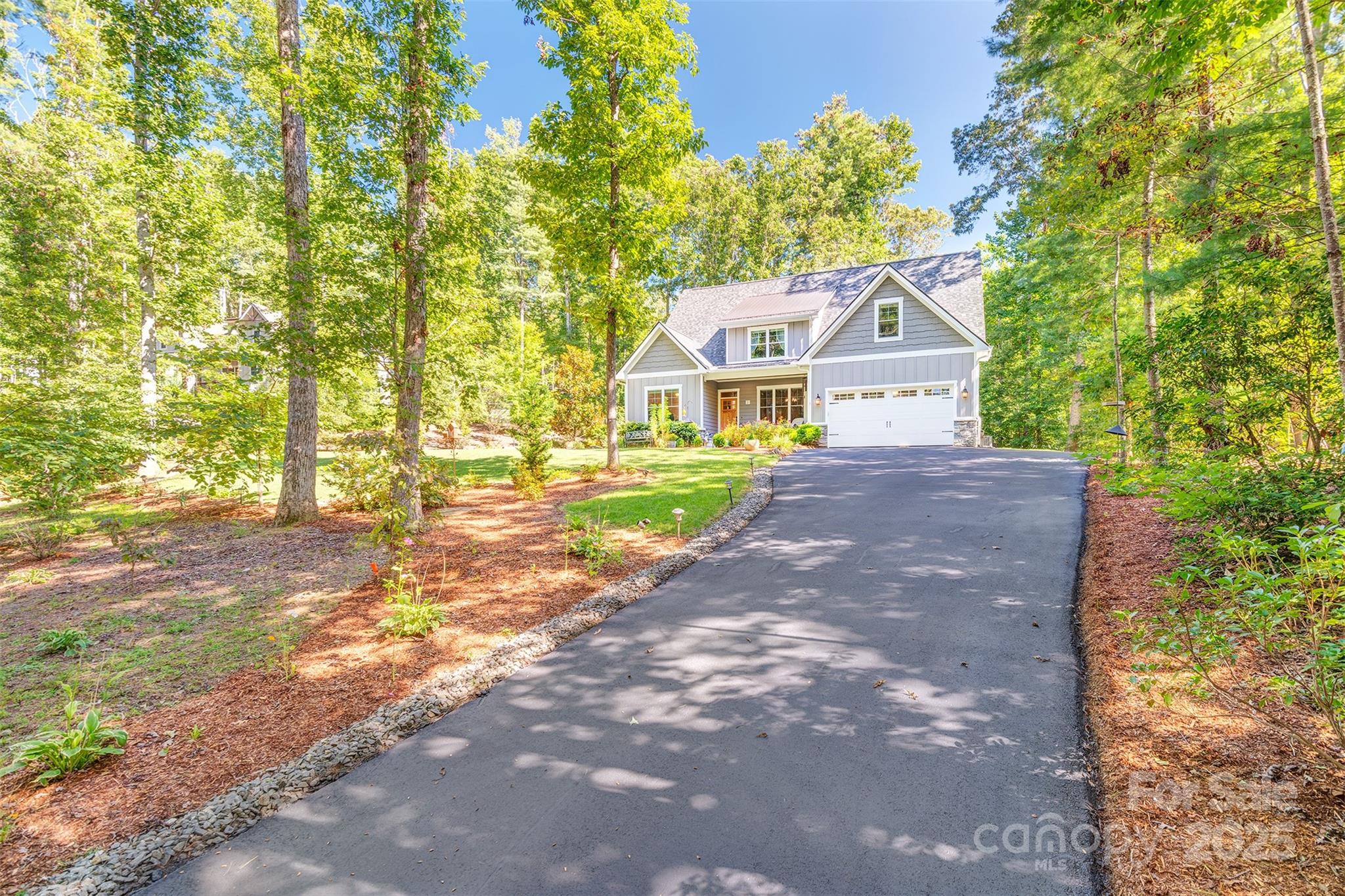21 Ducketts Grove Road Fletcher, NC 28732 - Photo 40 of 42 a front view of a house with a yard and garage