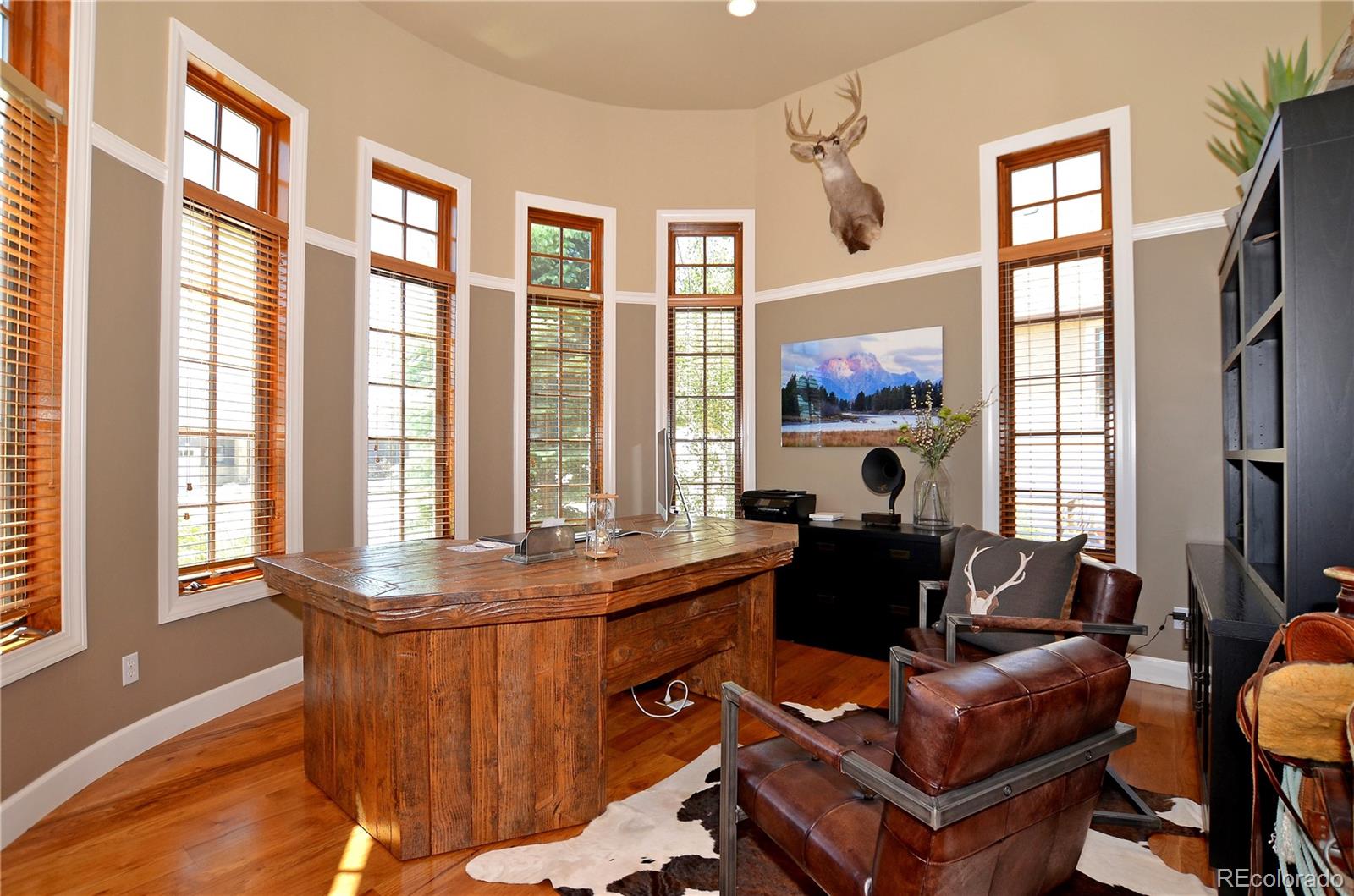 1820 Seashell Court Windsor, CO 80550 - Photo 16 of 40 a living room with furniture and a large window