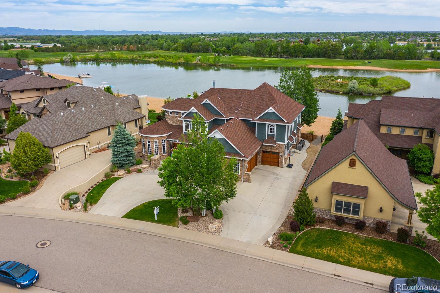 1820 Seashell Court Windsor, CO 80550 - Photo 2 of 40 an aerial view of a house with outdoor space and lake view