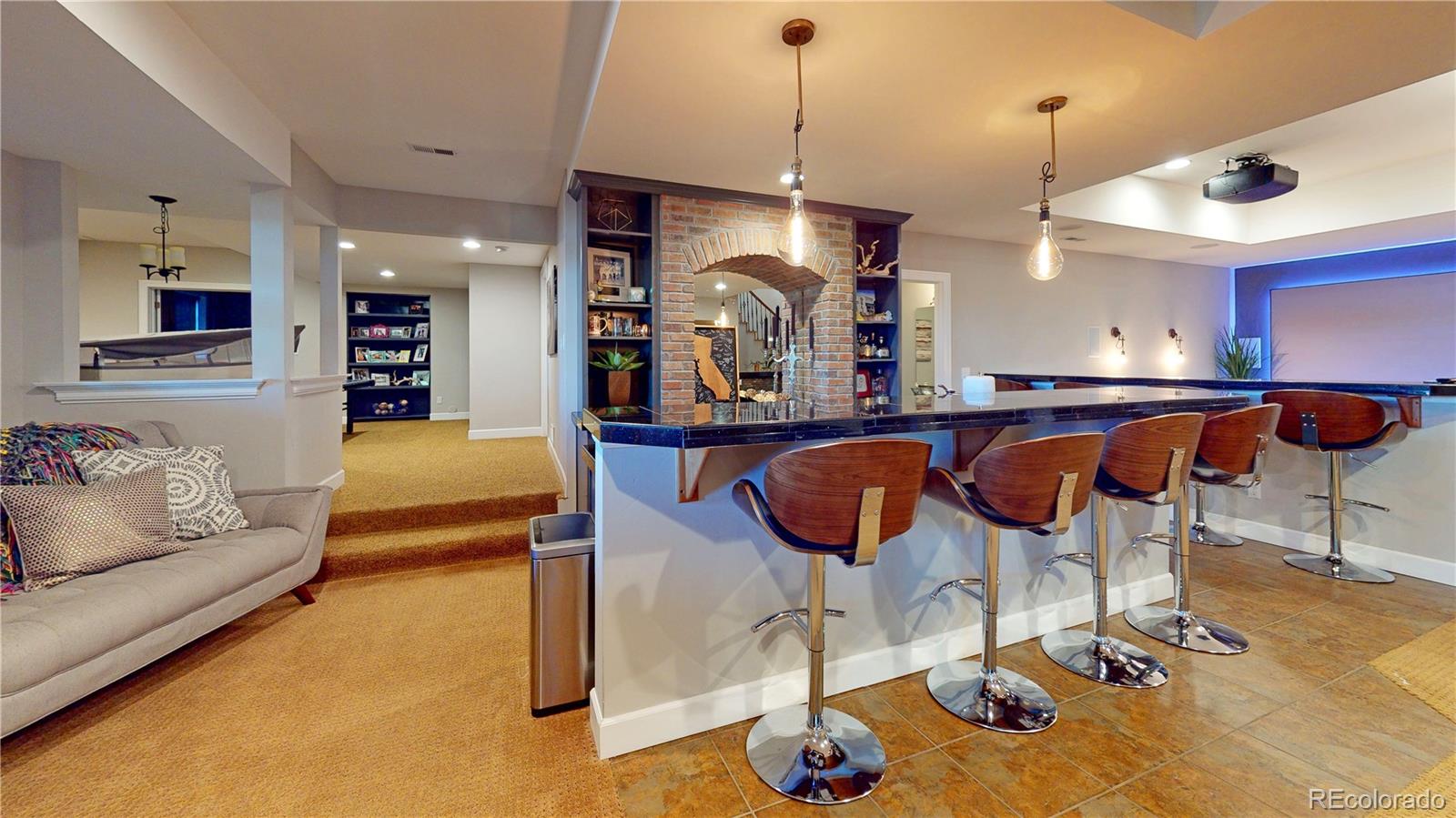 1820 Seashell Court Windsor, CO 80550 - Photo 28 of 40 a kitchen with a dining table and chairs